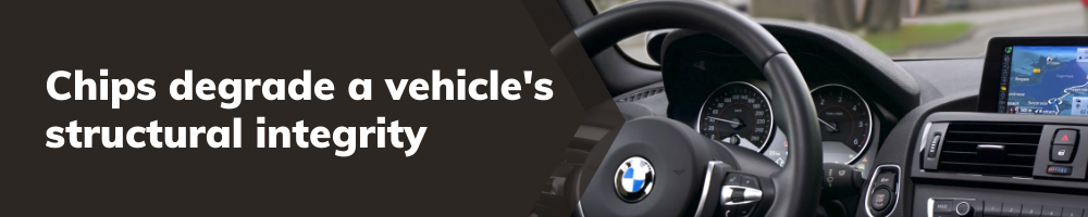 A banner with the text "Chips degrade a vehicle's structural integrity" in bold white letters against a dark background. To the right, the image shows the interior of a BMW, focusing on the steering wheel, dashboard, and infotainment system with a navigation display.
